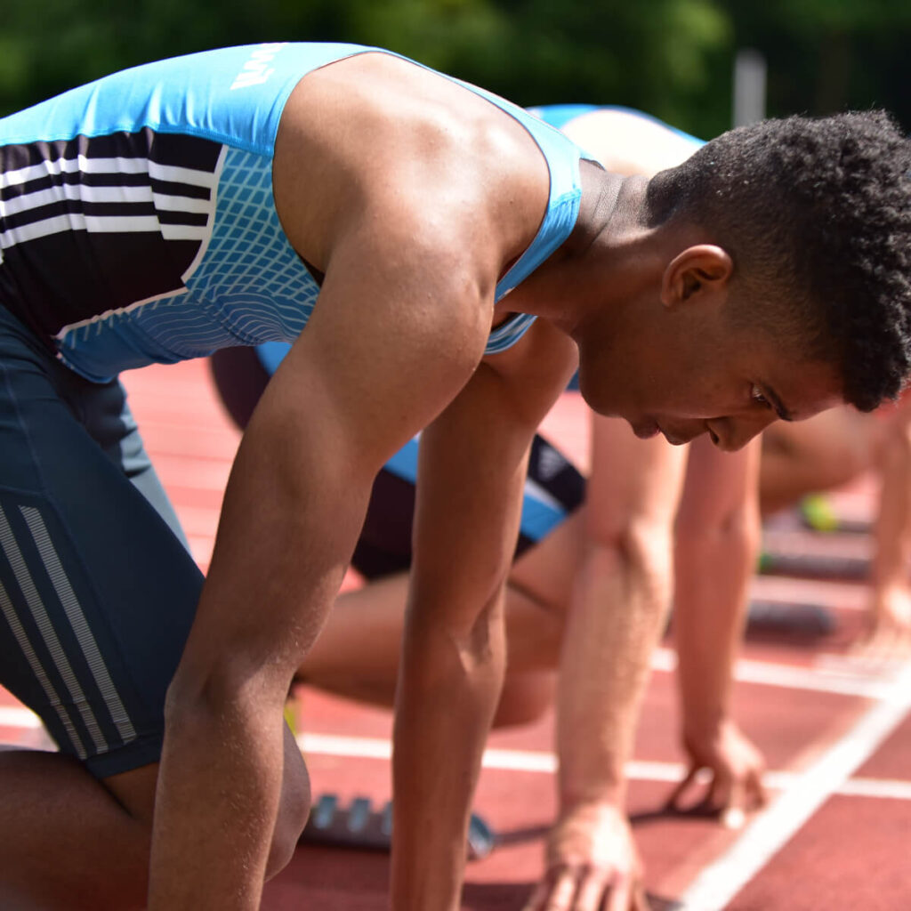 young athlete on running track after preworkout meal